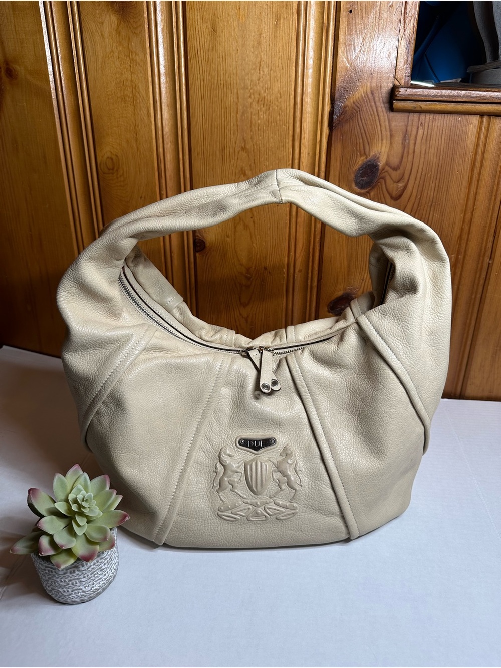 Cream Leather Shoulder Hobo Bag with Embossed Crest